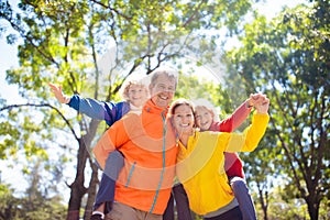 Family walking in autumn park. Fall fun