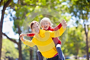 Family walking in autumn park. Fall fun