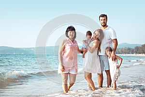 Family walking on the beach