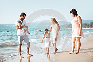 Family walking on the beach