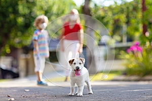 Family walking dog during virus outbreak