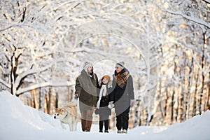 Family Walking Dog in Winter Park