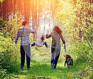 Family walking in the forest