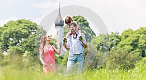 Family walking on meadow having walk