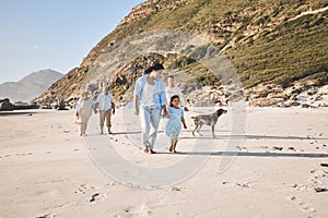 Family, walking and outdoor with a dog at the beach in summer for fun, freedom and vacation. People, child and a pet