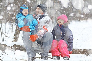 Family walking in snowy park