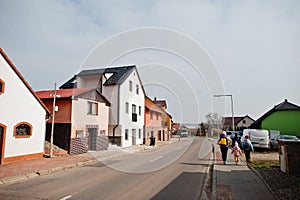 Family walking streets of village in Czech Republik