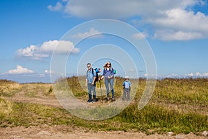 Family is walking trough mountain photo