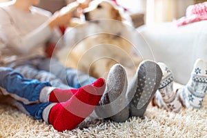 Family in Warm Socks Sitting in a Cosy Christmas Atmosphere