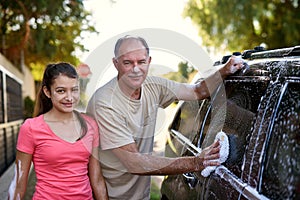 Family, washing car and portrait of man with daughter outdoor for cleaning in summer. Kids, love or smile with father