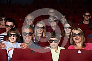 Family Watching 3D Film In Cinema