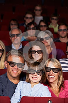 Family Watching 3D Film In Cinema