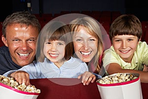 Family Watching Film In Cinema