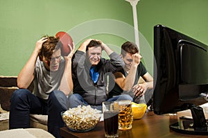 Family watching super bowl, near miss