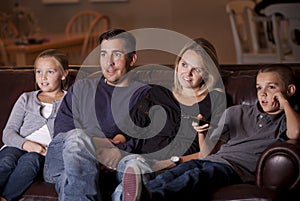 Family watching Television together