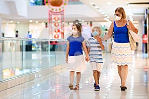 Family wearing face mask in shopping mall in Asia