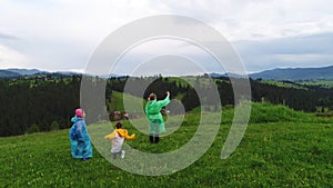 Family wearing raincoats