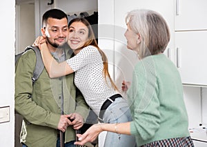 Family welcoming and embracing man who came after work trip
