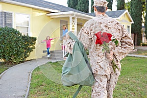 Family Welcoming Husband Home On Army Leave photo