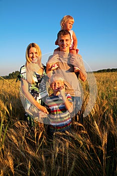 Family on wheaten field