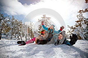 Family on winter vacation - Ski, snow, sun and fun