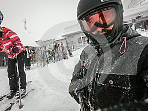 Family on winter vacations taking selfie on mountain slope