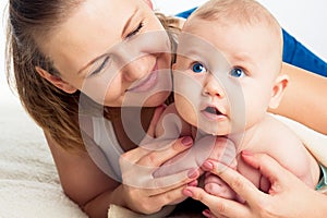 Family. Woman with a child. Portrait of beautiful smiling young mother with a baby