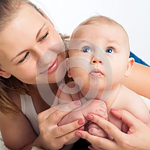 Family. Woman with a child. Portrait of beautiful smiling young mother with a baby