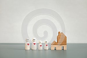 Family wooden dolls and home model, family and home concept