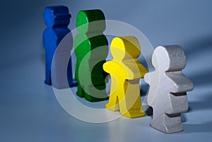 Family of wooden toys on gray isolated background