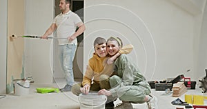 Family Working Together on Home Renovation in New Apartment
