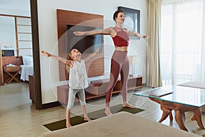 Family Workout At Home. Mother And Daughter Exercising In Living Room. Little Girl And Young Woman Practicing On Mat.