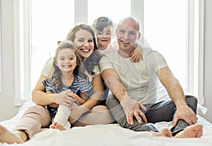 Family with young children to bed in the bedroom