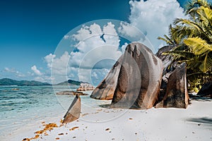 Famous Anse Source d`Argent beach on La Digue, Seychelles. Huge surreal shaped granite boulders on tropical shore