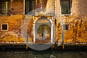 Famous architectural monuments and colorful facades of old medieval buildings close-up n Venice, Italy.