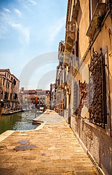 Famous architectural monuments and colorful facades of old medieval buildings close-up n Venice, Italy.