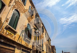 Famous architectural monuments and colorful facades of old medieval buildings close-up n Venice, Italy.