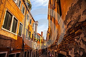 Famous architectural monuments and colorful facades of old medieval buildings close-up n Venice, Italy.