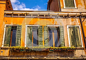 Famous architectural monuments and colorful facades of old medieval buildings close-up n Venice, Italy.