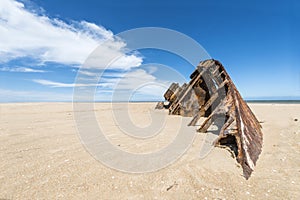 Famous Beach El Barco with rusty barge in Uruguay