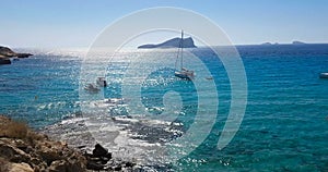 Famous, beautiful beach at daylight with calm sea, in summer very popular, sandy coast have a fantastic view of island of ibiza.