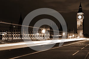 Famous and Beautiful night view to Big Ben and Houses of Parliament through night traffic, London, UK