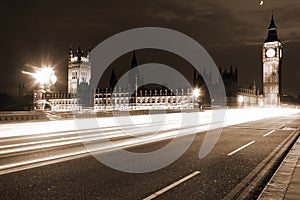 Famous and Beautiful night view to Big Ben and Houses of Parliament with Westminster bridge through night traffic, London, UK