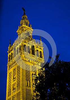 Bell Tower named Giralda in catholic Cathedral of Saint Mary in Seville, Spain