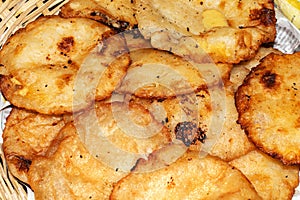 Famous Bengali fried cake recipe isolated in bamboo basket at village kitchen in India