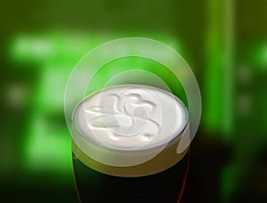 Famous black Irish stout with a frothy shamrock. photo