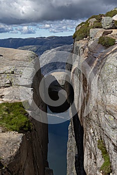 The famous boulder Kjeragbolten that is wedged in a mountain crevasse, Norway