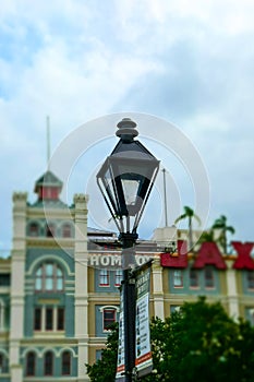 Famous Bourbon Street, Mystical New Orleans. Ancient street lamp and road sign