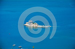 The famous Bourtzi, a Venetian water fortress at the entrance of the harbour in Nafplio seaside city in Argolis, Peloponnese,