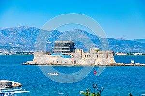 The famous Bourtzi, a Venetian water fortress at the entrance of the harbour in Nafplio seaside city in Argolis, Peloponnese,